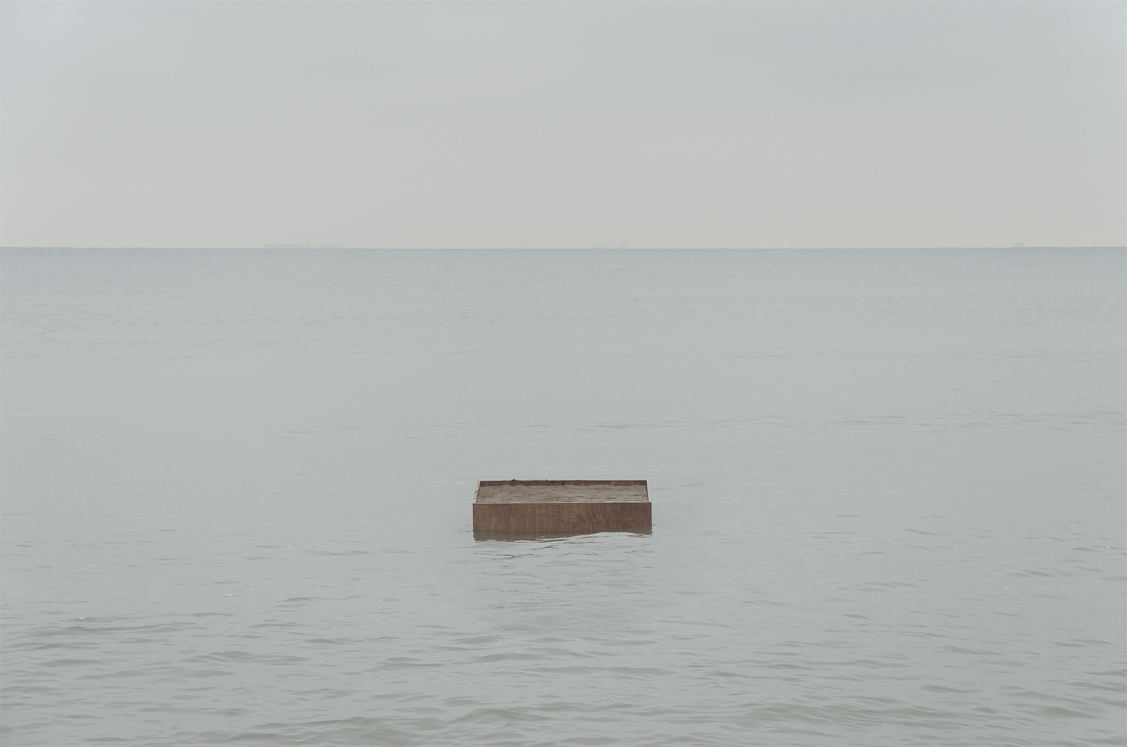a floating wooden platform drifting