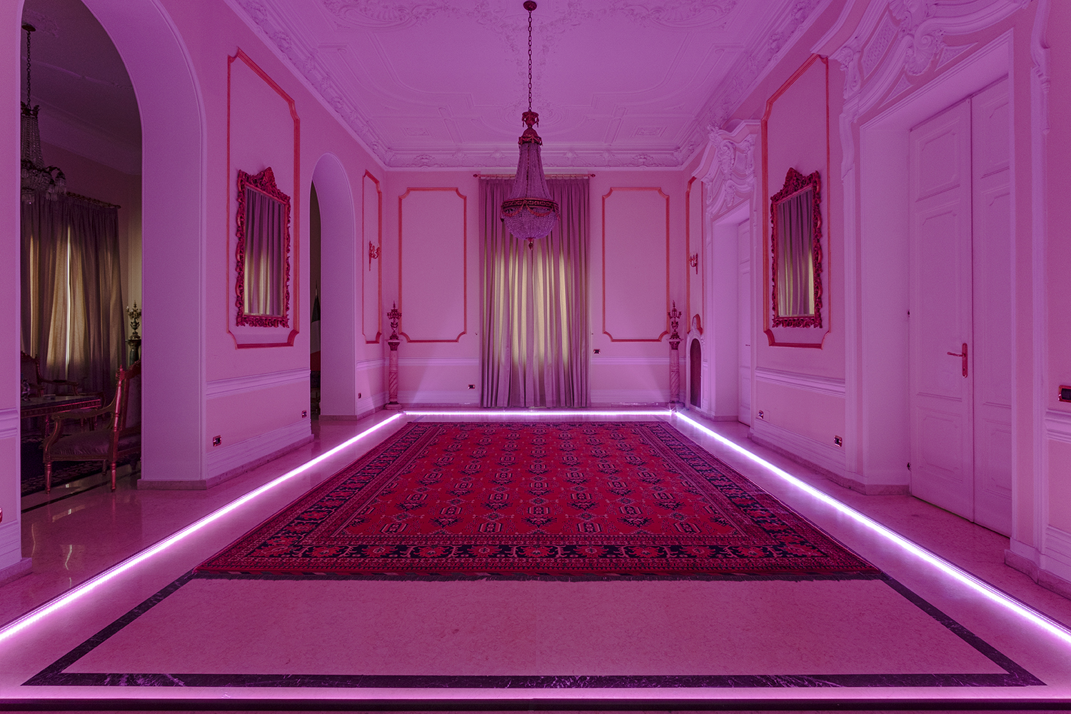 LED lights for indoor cultivation are placed along the edges of the Islamic rugs