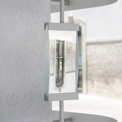 A site-specific installation with a magnifying glass that shows a flipped door